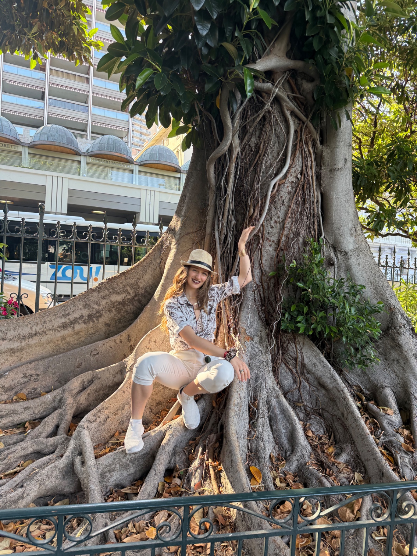 Frauke sitting among the roots of an old fig tree